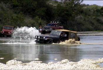 [Picture of off-road vehicle shredding in the water]