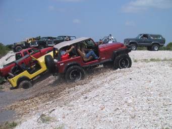 [More jeeps ripping up a gravel bank]